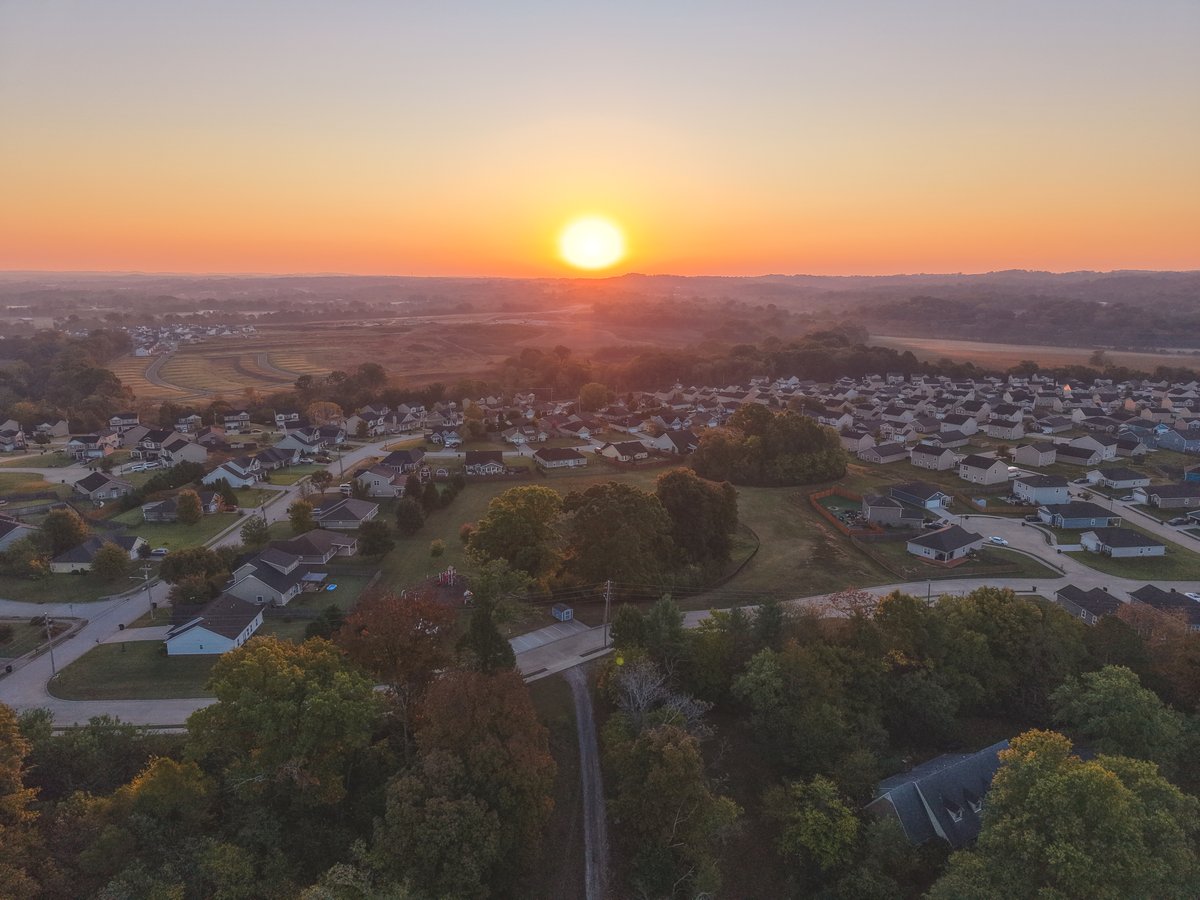 Aerial view of sunrise over neighborhoods and fields in Columbia, Tennessee.